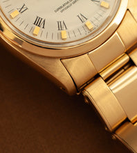 Afbeelding in Gallery-weergave laden, Rolex Oyster Perpetual 6748 &#39;White Buckley Dial / 18K Gold / Riveted Oyster&#39; (1978)

